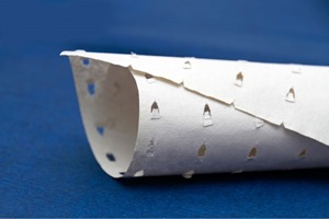 Perforated interlay tissue paper